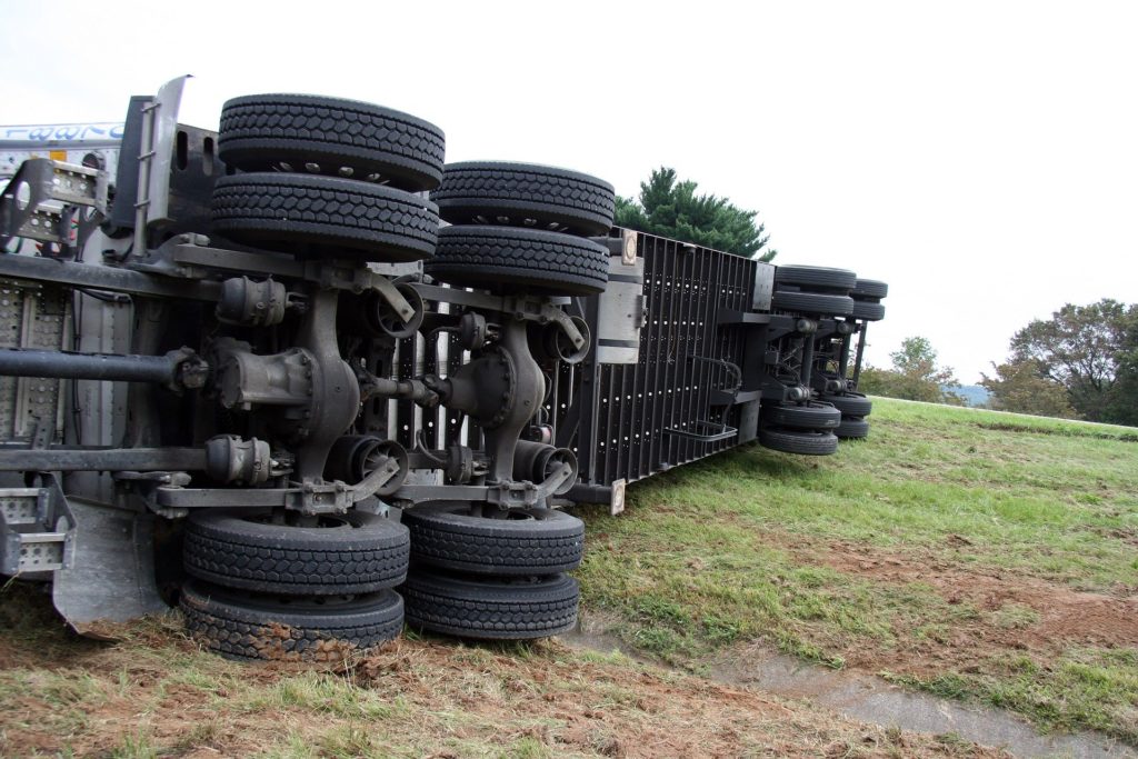 A semi-truck that has rolled over